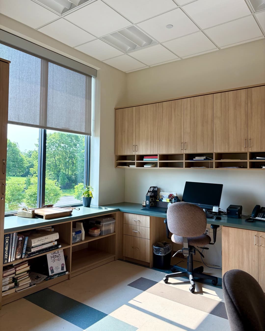 Light brown home office with built-in desk and bookshelves
