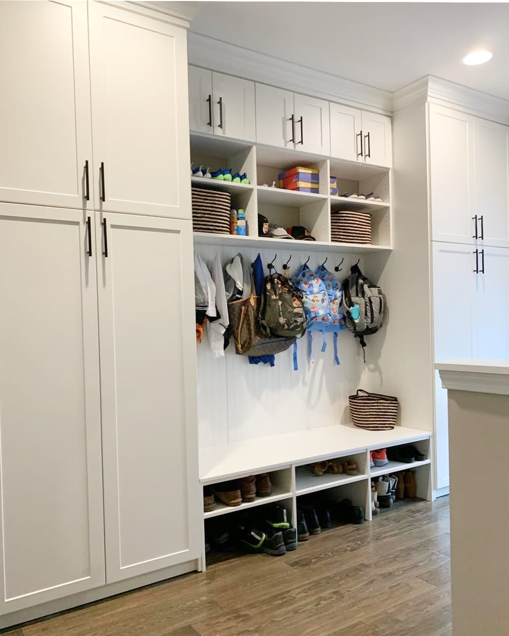 White custom mudroom with built-in storage