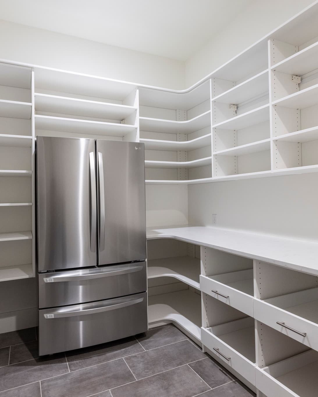 Custom walk-in pantry with floor-to-ceiling shelving