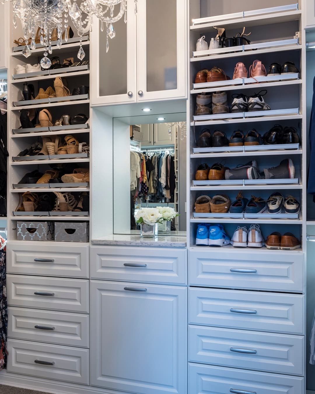 Custom closet shoe storage with chandelier