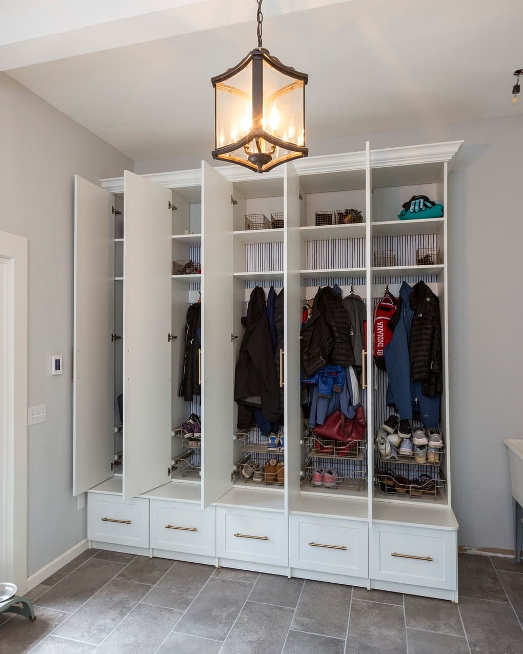 Custom mudroom lockers with coat storage and shoe cubbies